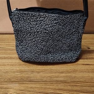 Black and gray ladies purse by The Sak